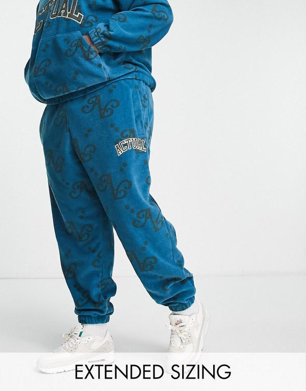 ASOS Actual relaxed polar fleece trackies with all over print and applique logo in blue (part of a set)