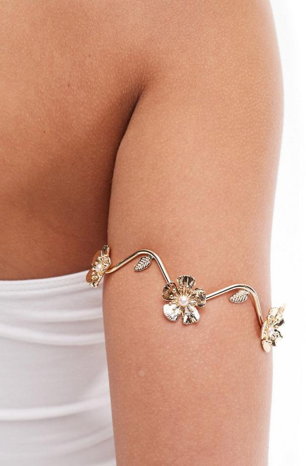 ASOS DESIGN arm cuff with floral and leaf design in gold tone
