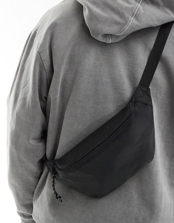 ASOS DESIGN cross body bum bag with contrast puller in black