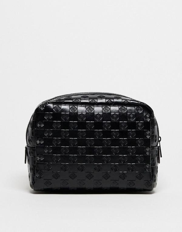 ASOS DESIGN faux leather wash bag with embossed checkerboard design in black