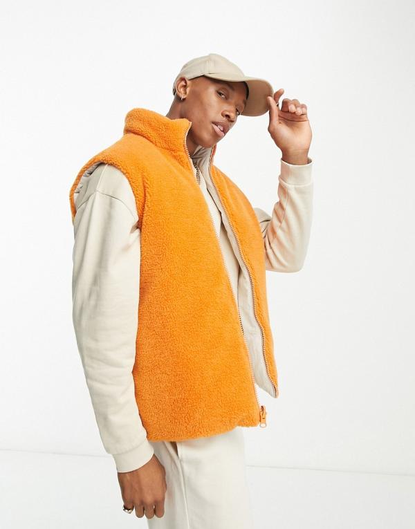 ASOS DESIGN orange and white reversible puffer vest