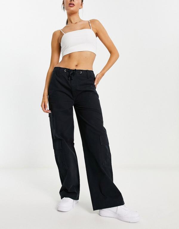 ASOS DESIGN oversized cargo pants with multi pocket and tie waist in black