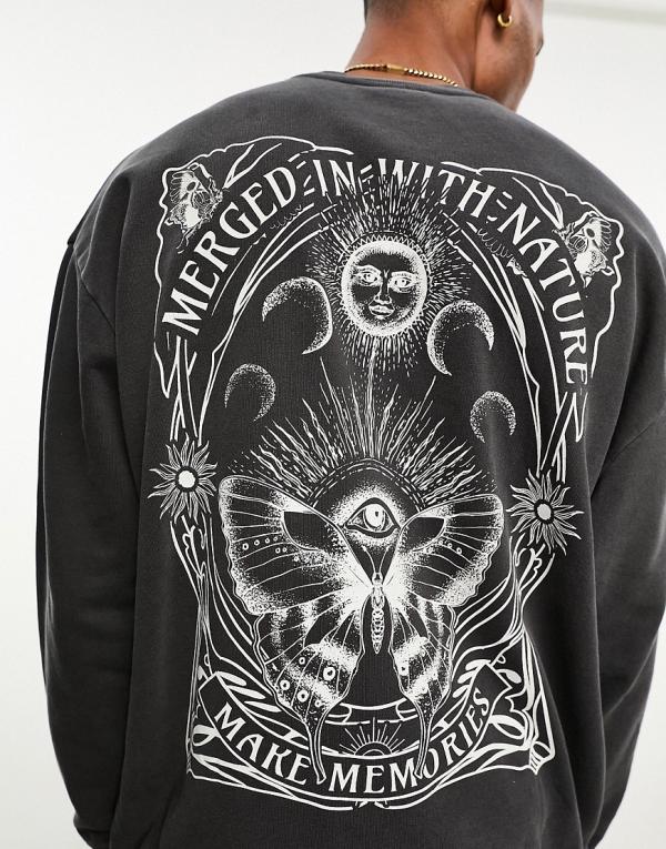 ASOS DESIGN oversized sweatshirt in washed black with celestial back print