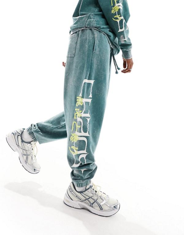 ASOS DESIGN oversized trackies in dark green acid wash with side text print & embroidery (part of a set)