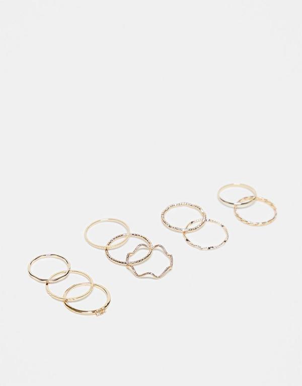 ASOS DESIGN pack of 12 rings with twist details and engraved designs in gold tone