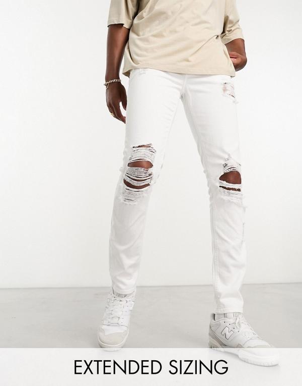 ASOS DESIGN skinny jeans with heavy rips in white