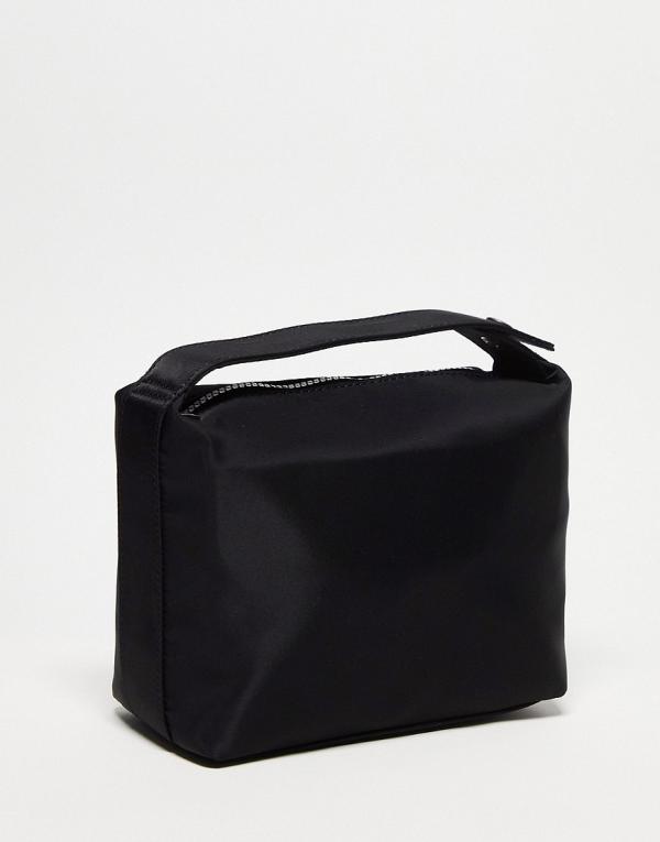 ASOS DESIGN wash bag with grab handle in black