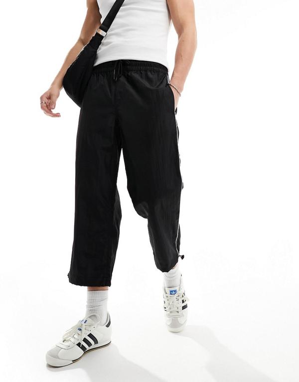ASOS DESIGN wide awkward length nylon pants with toggle detail in black
