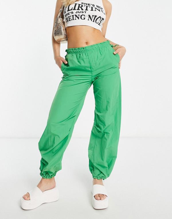 Bershka baggy parachute tech pants in green