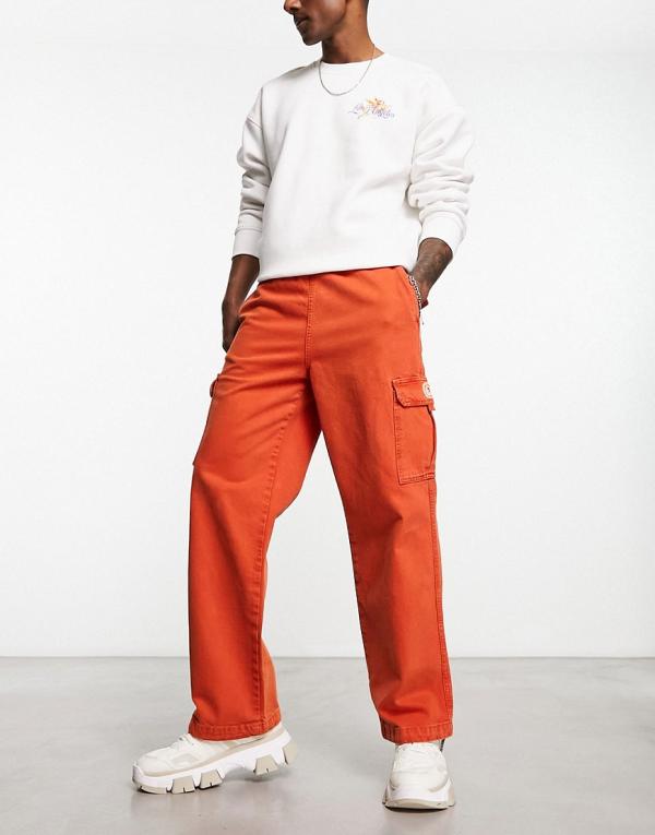 Damson Madder worker chino pants in washed red