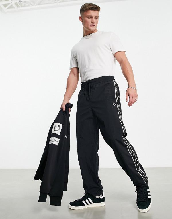 Fred Perry side taping shell trackies in black
