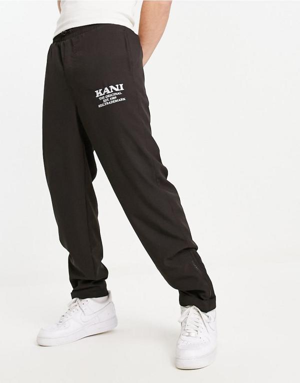 Karl Kani retro straight leg pants in black with zip hem detail