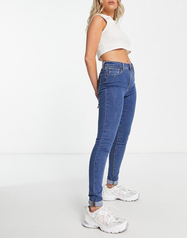 Levi's 721 high rise skinny jeans in mid wash blue