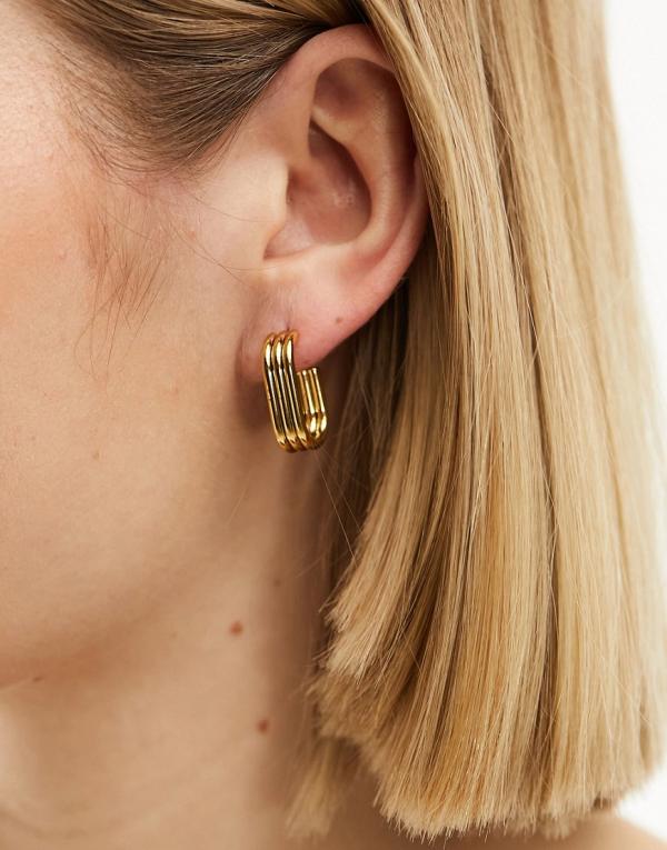 Lost Souls stainless steel oval hoop earrings in gold tone