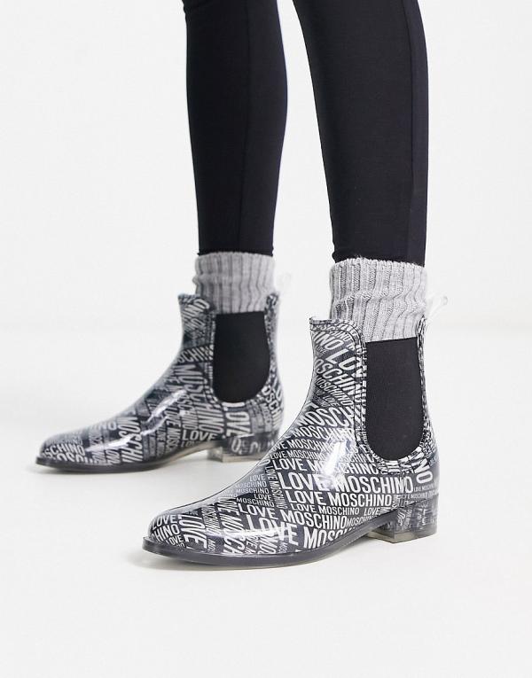 Love Moschino all over logo boots in silver