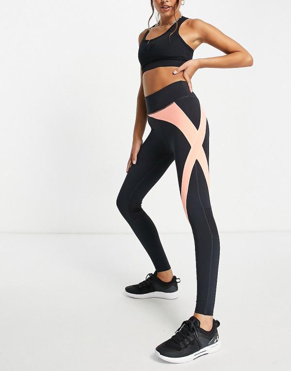 Only Play high-waisted legging in black and coral colour- block