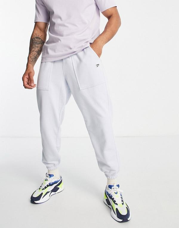 Puma Downtown trackies with checkerboard pocket in pale blue