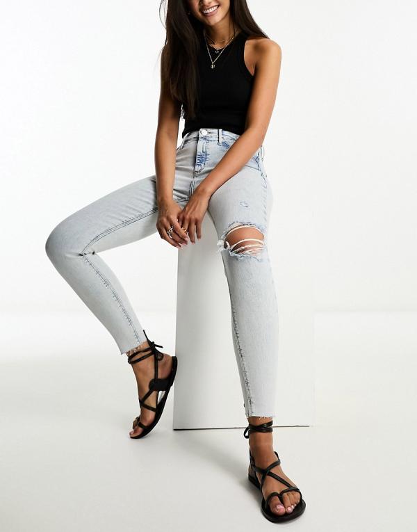 River Island Molly mid rise skinny jeans with ripped knee in light blue wash