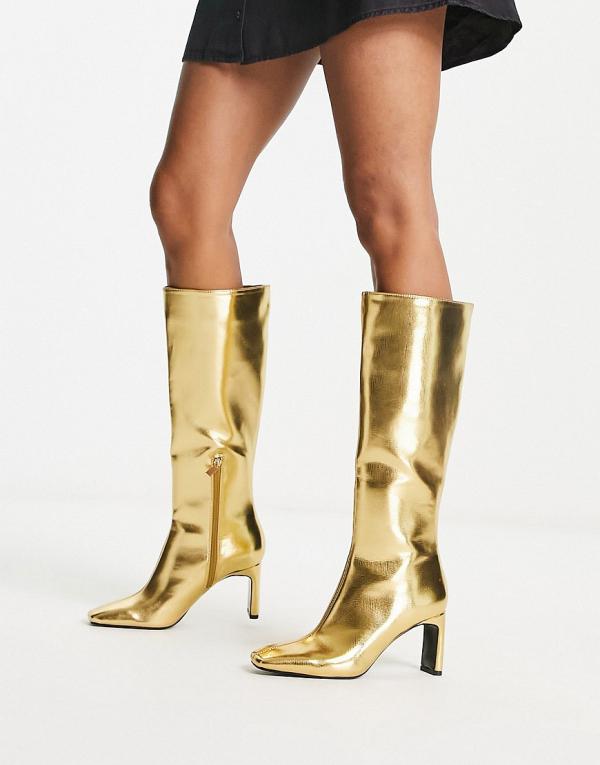 Stradivarius knee high boots in gold