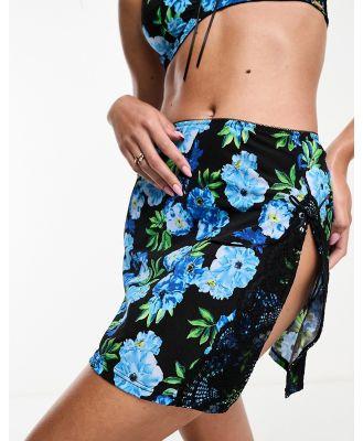We Are We Wear floral printed micro skirt in black and blue-Multi