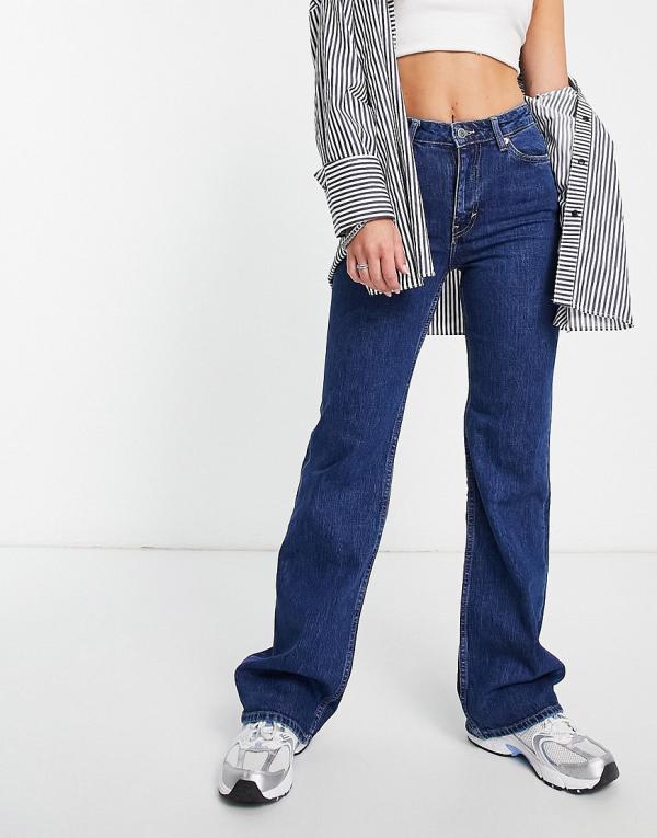 Weekday Glow High flared jeans in mid blue