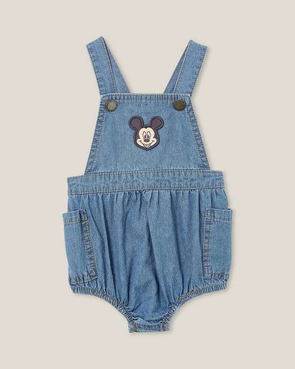 Cotton On Baby - Disney Mickey Marley Woven Frill Bubbysuit    Babies - Bodysuits (Licensed Mid Blue Chambray & Mickey Badge) Disney Mickey Marley Woven Frill Bubbysuit  - Babies