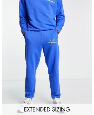 ASOS Dark Future relaxed trackies with logo graphic print in blue (part of a set)