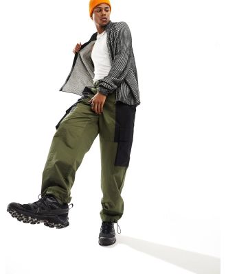 ASOS DESIGN baggy cargo pants in khaki and black colour blocking with belt detail in nylon-Green