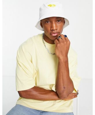 ASOS DESIGN bucket hat in white with lemon embroidery