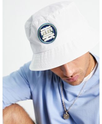 ASOS DESIGN bucket hat in white with patch
