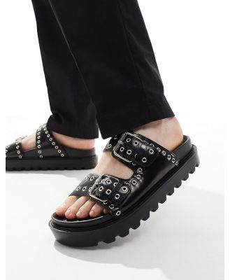 ASOS DESIGN chunky buckle sandals in black PU with all over silver eyelets