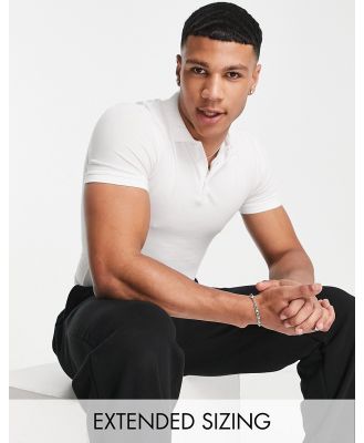 ASOS DESIGN cotton blend muscle fit polo in white