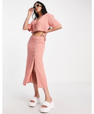 ASOS DESIGN crinkle button side midi skirt in pink (part of a set)