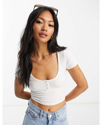 ASOS DESIGN deep scoop neck crop baby tee in rib with poppers in white