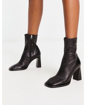 ASOS DESIGN Echo premium leather heeled sock boots in black