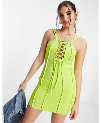 ASOS DESIGN exposed seam ribbed mini dress with lace up front in lime-Green