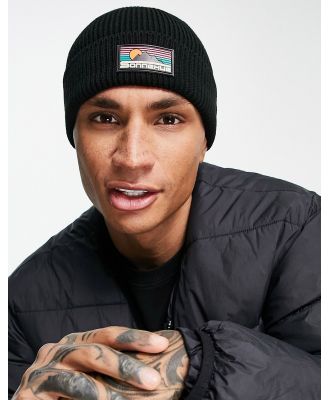ASOS DESIGN fisherman ribbed beanie with rubber logo in black