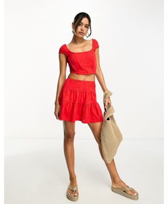 ASOS DESIGN flippy broderie mini skirt in red