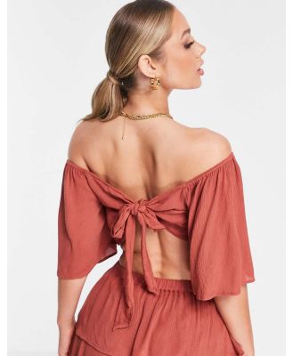 ASOS DESIGN floaty bow back beach crop top in rust-Brown