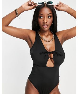 ASOS DESIGN Fuller Bust tie front cut out swimsuit in black