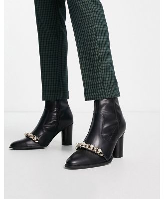 ASOS DESIGN heeled chelsea boots in black faux leather with pearl chain detail