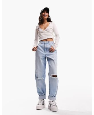 ASOS DESIGN high rise relaxed mom jeans in light blue with knee rips