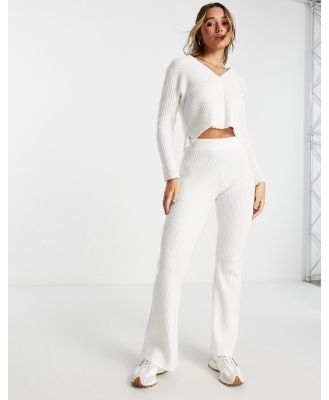 ASOS DESIGN knitted flare pants in cream-White