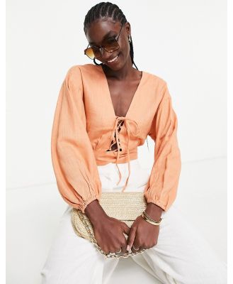 ASOS DESIGN linen top with lace up front & volume sleeve in peach-Orange