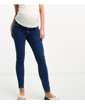 ASOS DESIGN Maternity skinny jeans in mid blue with over the bump waistband