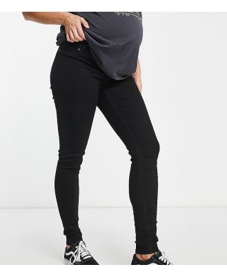 ASOS DESIGN Maternity skinny jeans with over bump in black