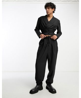 ASOS DESIGN oversized balloon lace up suit pants in black