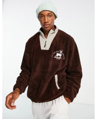 ASOS DESIGN oversized half zip sweatshirt in brown borg with pattern tape-Red