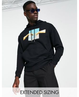 ASOS DESIGN oversized hoodie with Michelangelo prints in black