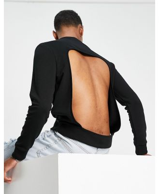 ASOS DESIGN oversized sweatshirt in black with back cut out